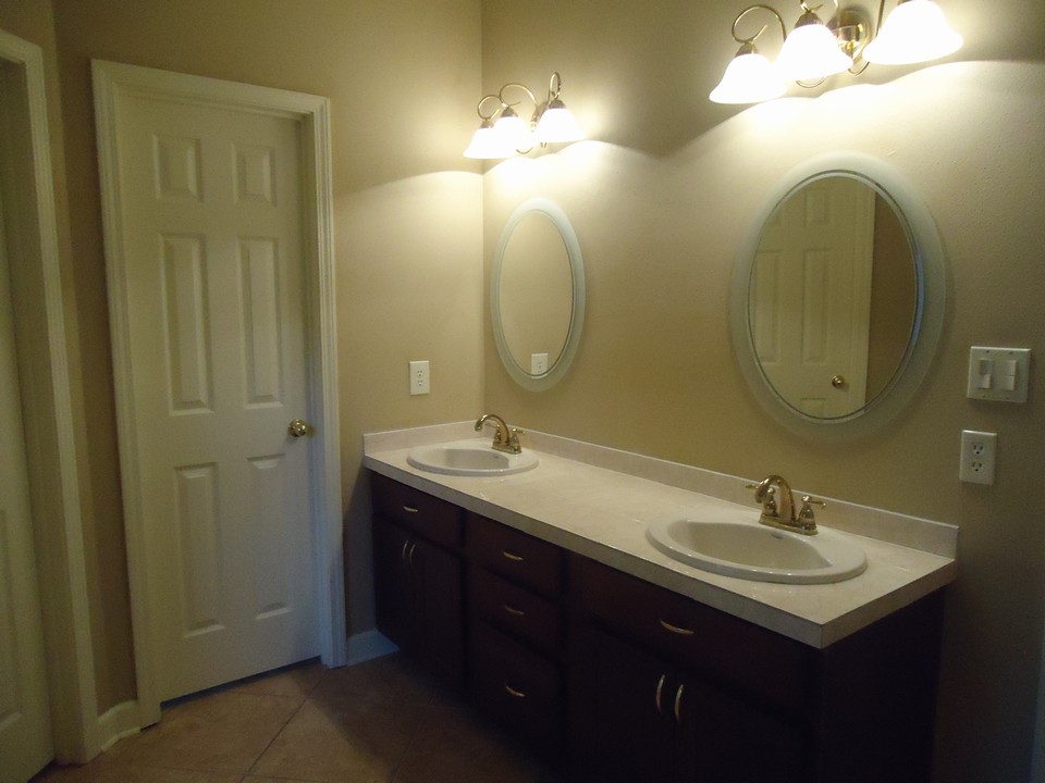 supreme master bath has been updated, and offers all of the bells and whistles!! double vanities, upgraded ceramic tile, separate tub and shower. double closets, with custom organizers.