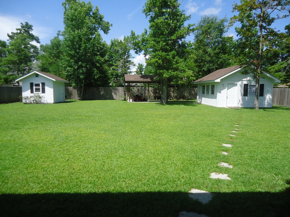 backyard tool shed and a separate living quarters are situated in backyard.