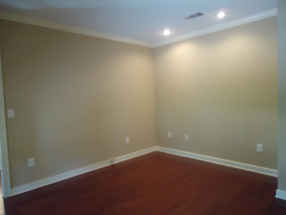formal living room formal living room has hardwood floors, crown molding, neutral colors and recessed lighting.